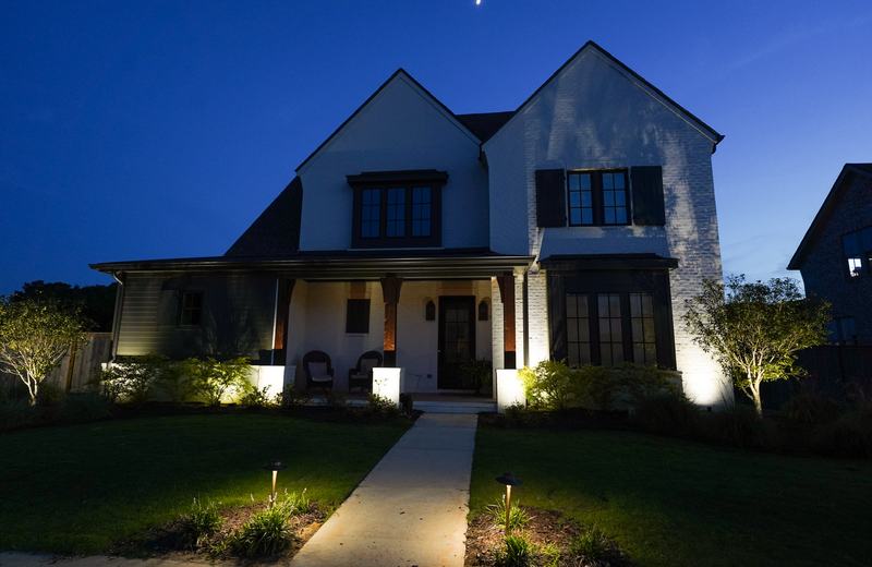 White farmhouse front, porch + walkway (pro)