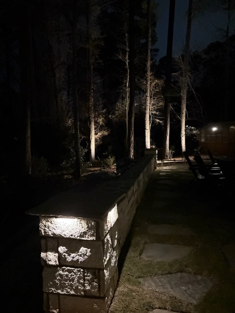 Step, Stair & Hardscape Lighting project — Stone seating wall wall-washed in woods