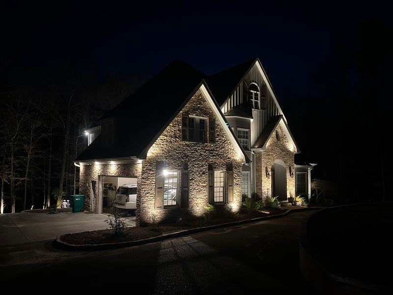 Stone-and-gable house, balanced uplighting
