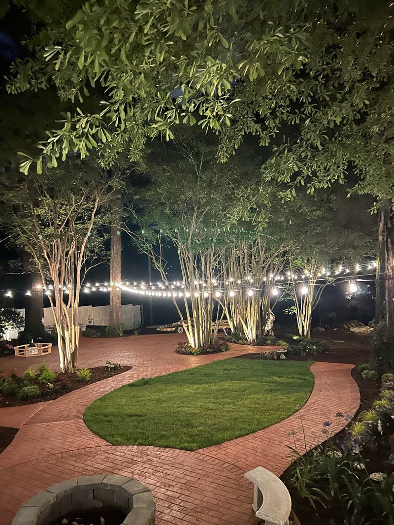 Patio, Pool & Backyard Lighting project — Backyard string lights over brick path + crape myrtles