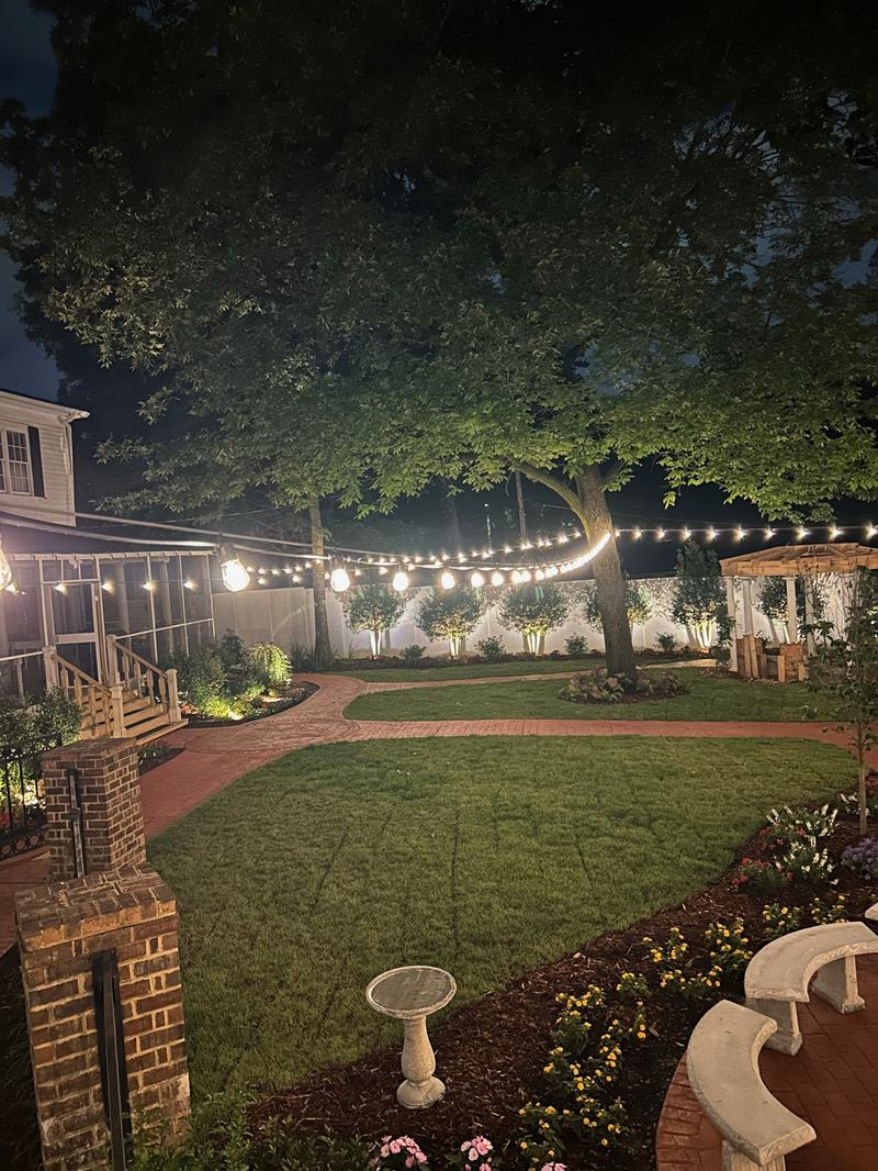 Patio, Pool & Backyard Lighting project — String-light canopy over garden lawn, gazebo