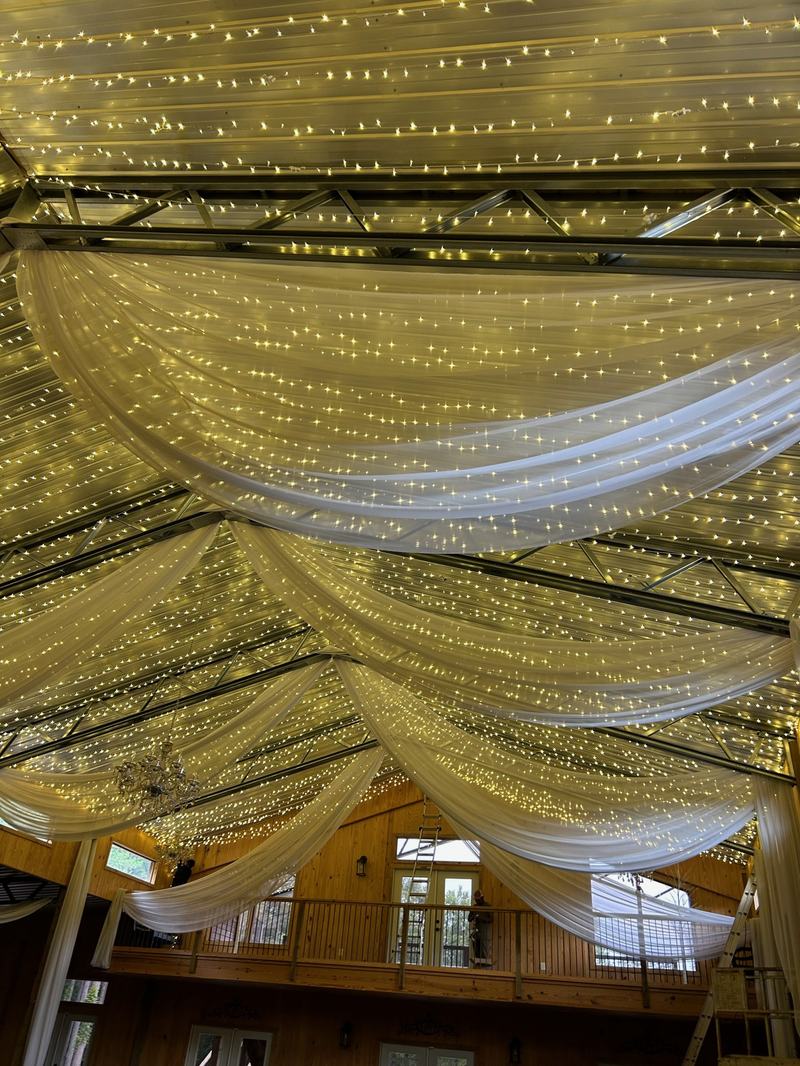 Bistro, String & Event Lighting project — Wedding barn interior, draped twinkle lights