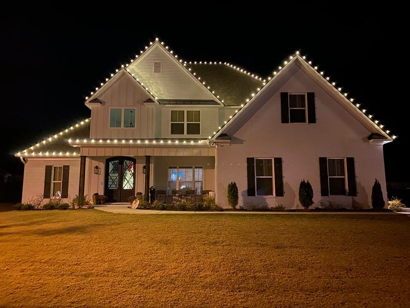 Permanent Outdoor Lighting (Color-Changing Trim) project — White farmhouse crisp C9 roofline, full front
