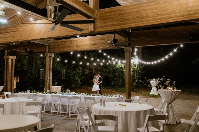 Patio, Pool & Backyard Lighting project — Couple dancing under pavilion string lights (wedding)