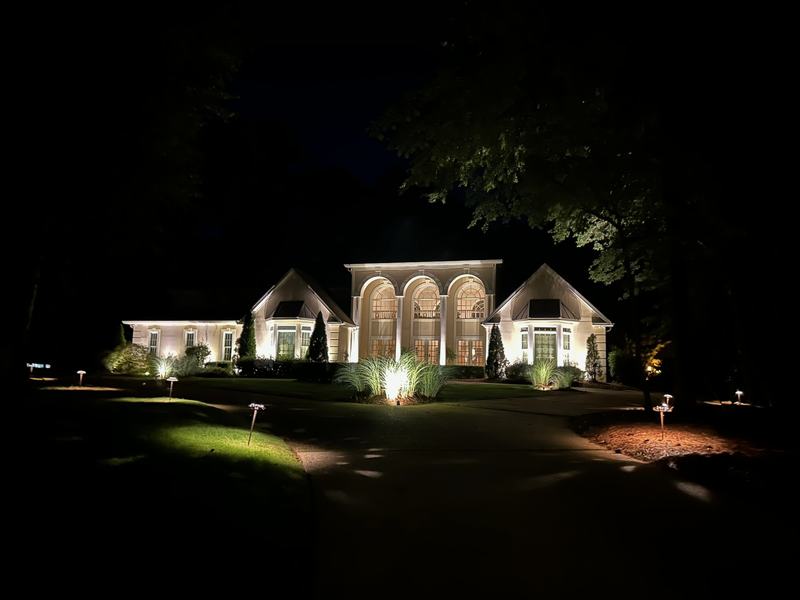 Architectural & Front-of-House Uplighting project — Arched-window estate, uplights + grasses